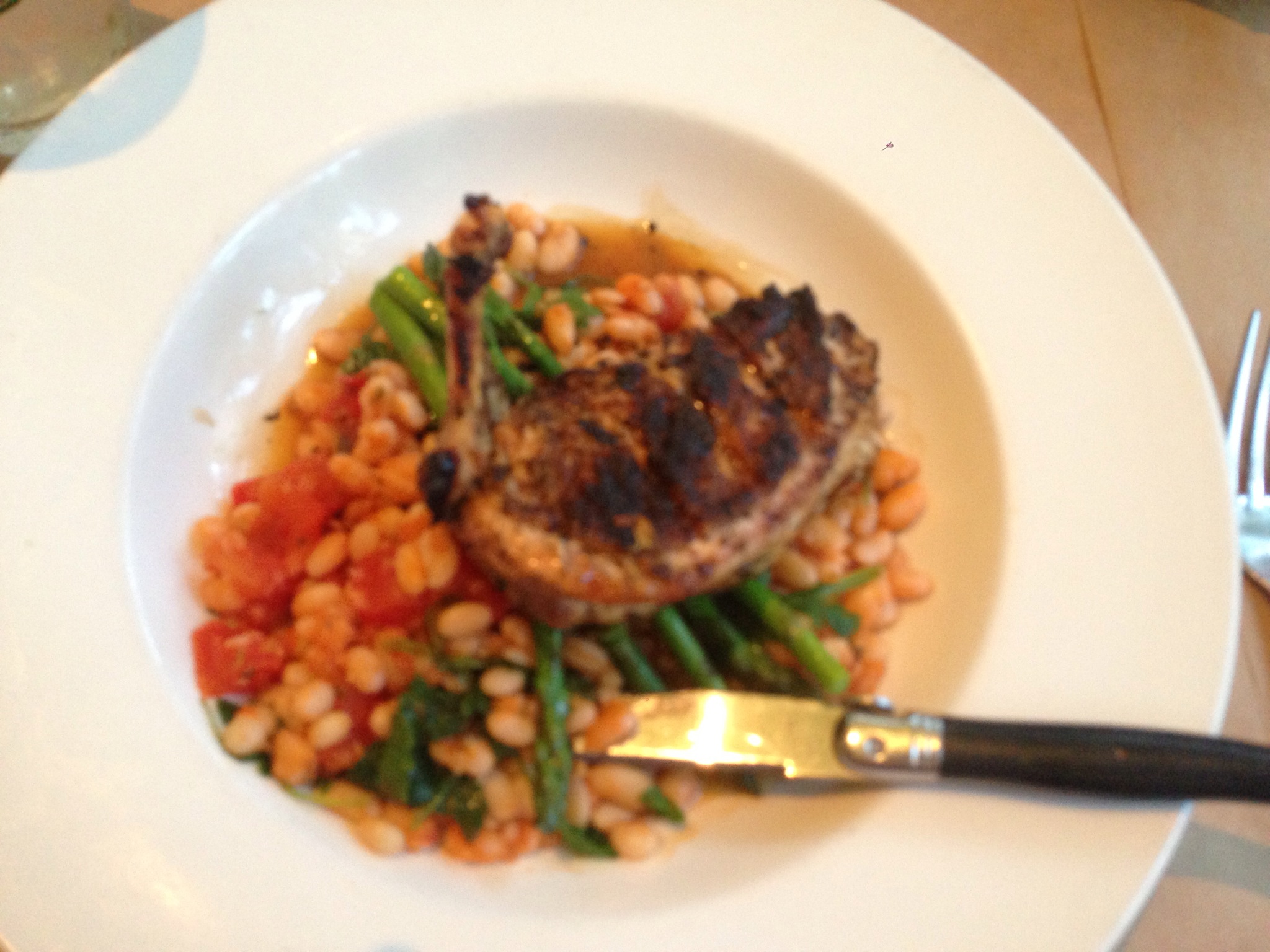 Best chicken I've had in years. Perfectly tender and flavorful chicken atop white beans with tomato, spinach and asparagus. 
